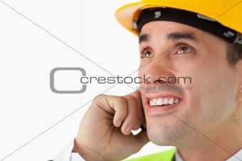Close up of architect on the phone looking upwards