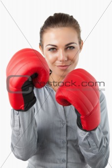 Businesswoman with boxing gloves