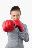 Boxing gloves used to slam by businesswoman