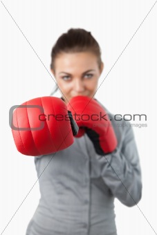 Boxing gloves used to slam by businesswoman