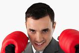 Close up of businessman with boxing gloves on