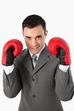 Close up of smiling businessman with boxing gloves on