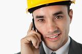 Close up of confident architect on the phone