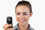 Close up of smiling businesswoman reading a text message