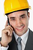 Close up of smiling architect talking on the phone