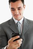 Close up of businessman writing text message on his phone