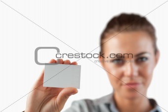 Close up of business card being shown by businesswoman