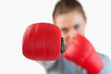 Close up of boxing glove used by businesswoman