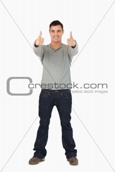 Young guy giving thumbs up