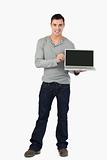 Young male presenting his laptop