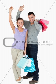 Happy young couple after shopping