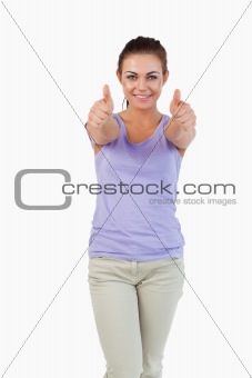 Young female giving thumbs up