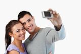 Young couple taking a picture of themselves