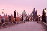 czech republic prague - charles bridge and spires of the old town at dawn