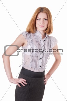 Self-confident young woman in blouse and skirt