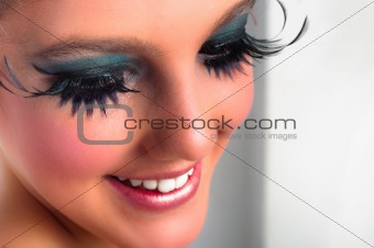 Closeup of a pretty girl with extreme makeup