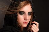 Black makeup and hood on a beutiful young girl