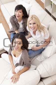 Three Beautiful Women Friends Eating Popcorn at Home