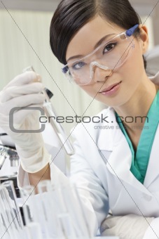 Chinese Female Woman Scientist With Test Tube In Laboratory