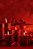 Christmas candles on a red background 