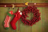 Christmas stockings and wreath hanging on  wall