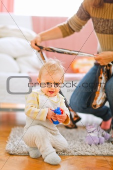 Lovely baby playing on floor
