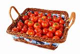 Cherry tomatoes basket on white