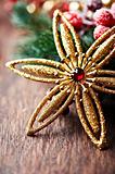 Golden christmas star on rustic wooden background