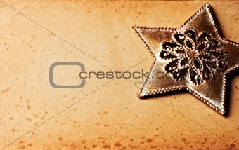 Vintage christmas star on old paper background