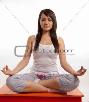 Attractive asian filipina woman doing yoga