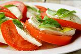 Traditional Italian Caprice salad tomato mozzarella cheese and basil