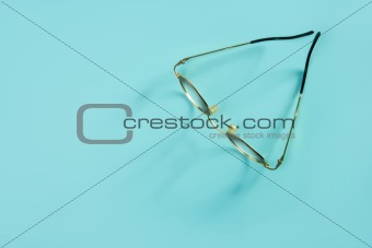 doctor glasses over green desk background