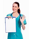 Smiling female doctor holding a clipboard against white backgrou