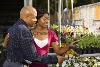 Couple buying plants.