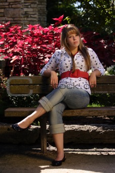 Girl Sitting on a Park Bench