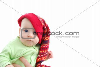 a little baby in a large red hut portrait isolated on white
