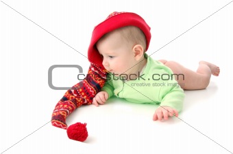 a little baby in a large red hut portrait isolated on white