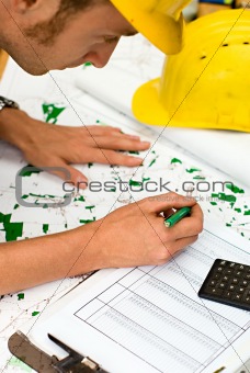 construction worker checking documents