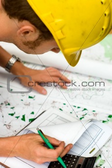 construction worker checking documents