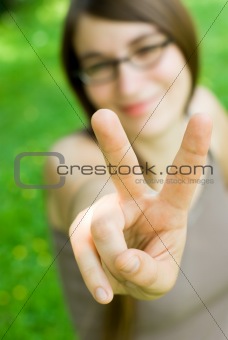 girl making victory gesture