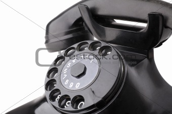 Detail of an old rotary telephone isolated on white