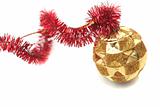 Red New Year's tinsel and gold sphere