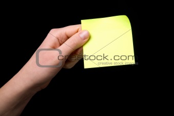 Holding a Sticky Note
