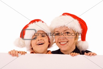 Santas behind white banner