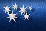 White paper stars on blue brocade