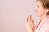 elderly woman praying 