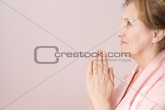 elderly woman praying 