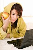 woman with laptop and apple