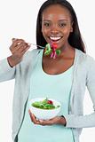 Happy smiling woman eating salad
