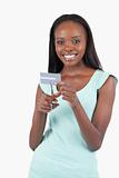 Happy smiling young woman destroying credit card
